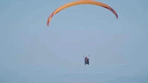 Three Paragliders Gracefully Gliding in Open Sky Stock Footage 304561732
