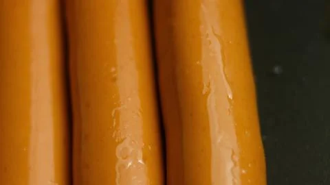 Three Parallel Sausages Framed as an Abstract Food Pattern Stock Photos