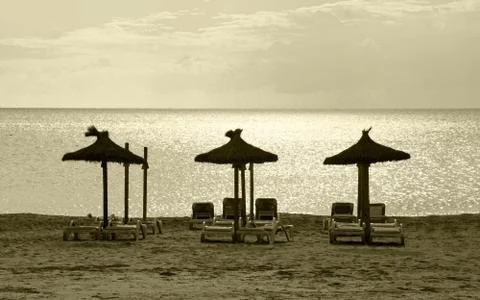 Three parasols  beach Stock Photos