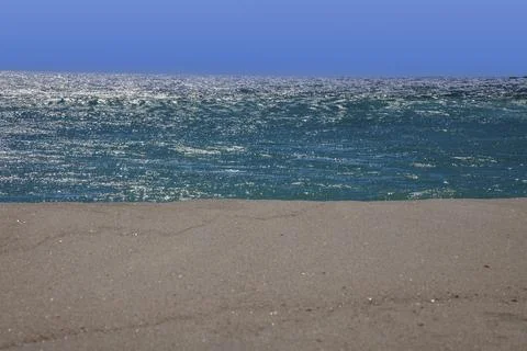 Three-part image of a white sandy beach in front of turquoise-green water a.. Stock-Fotos