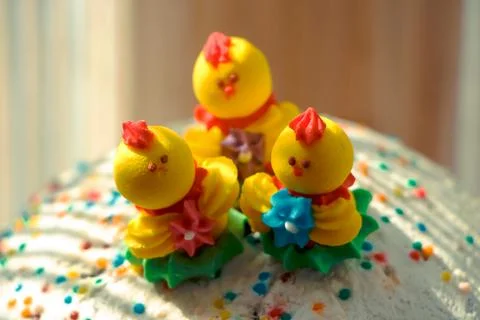 Three pastry miniature chickens on Easter baked goods Stock Photos