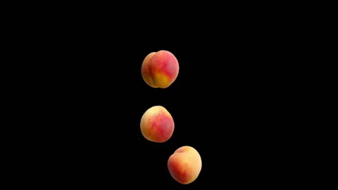 Three peaches falling on an black background. Stock Footage 178132117