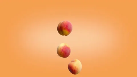 Three peaches falling on an orange background. Stock Footage 178003114