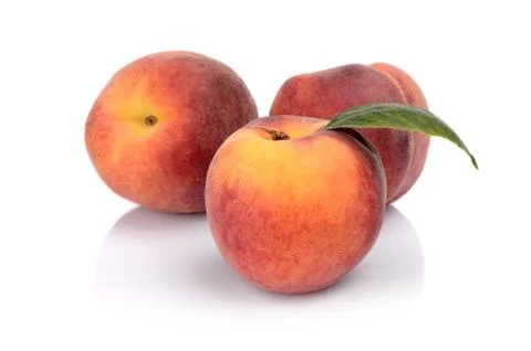 Three peaches with leaf isolated on white background Stock Photos