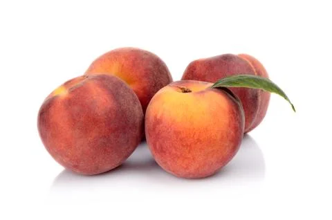 Three peaches with leaf isolated on white background Stock Photos