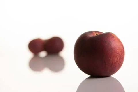 Three peaches on white background Stock Photos