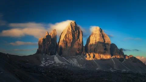 The Three Peaks of Lavaredo or Tre Cime di mountain at sunrise, Dolomites m.. Stock Photos