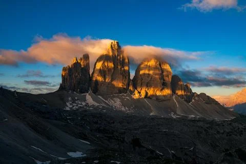 The Three Peaks of Lavaredo or Tre Cime di mountain at sunrise, Dolomites, Italy Stock Photos