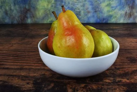 Three pears in bowl Stock Photos