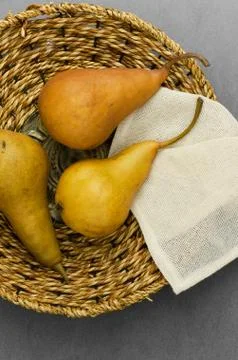 Three pears in rustic basket Stock Photos