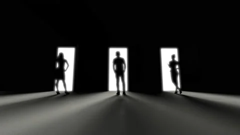 Three people are standing at three opening doors in the dark, rays of light pene Stock Footage 156529049