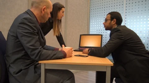 Three People Around Graphics On Computer Stock Footage 121614891