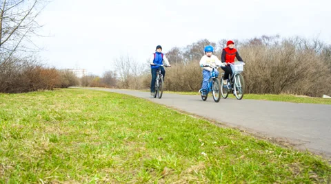 Three people on bikes in the park 스톡 동영상 37204921