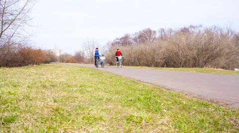 Three people on bikes in the park Stock Footage 37204969