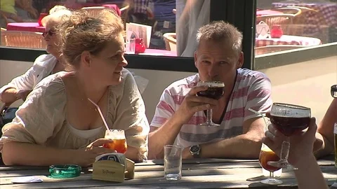 Three people drinking Belgian beer Stock Footage 69902943