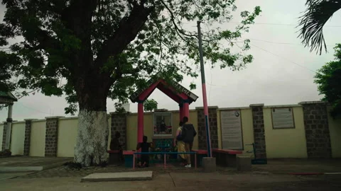 Three people gathering at religious altar in Brazzaville, Congo Vídeos de archivo 338167589