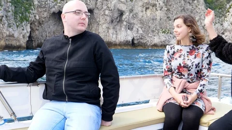 Three people having fun in the boat in Italy Stock Footage 107074541