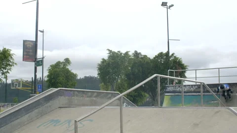 Three people jump at skatepark Stock Footage 171492624