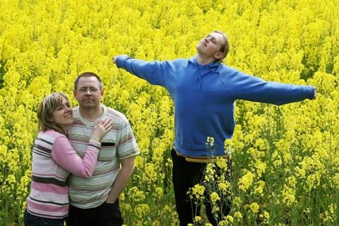 Three people in meadow Stock Photos