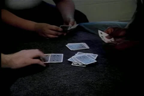 Three people playing cards Stock Footage 11349890