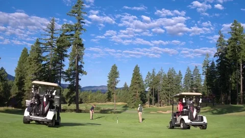 Three people playing golf on Suncadia Resort 動画素材 76236504