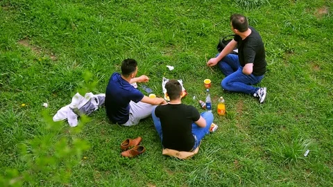 Three people resting at nature Stock Footage 89932845