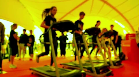 Three people running on treadmill at gym Stock Footage