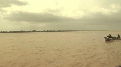 Three People In A Small Boat On the Amazon River Video stock 19212871