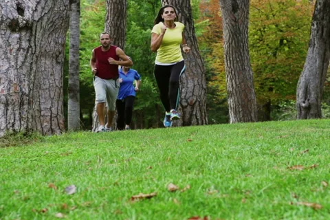 Three people training in the park, slow motion shot at 240fps, steadycam shot Stock Footage 43740926