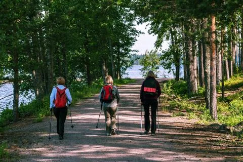 Three people on a walk. Stock-Fotos