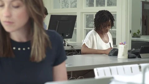 Three people working in an office Stock-Footage 83396167