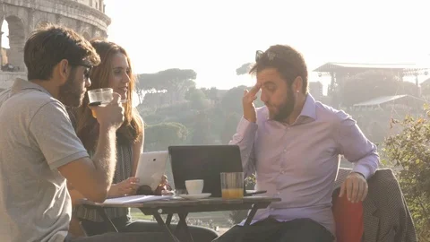 Three people working together on a project with laptop and tablet writing Video stock 90766674