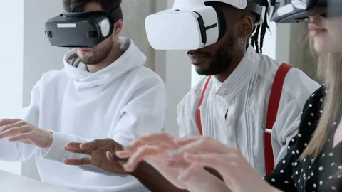 Three people working in virtual reality glasses. Stock Footage 99657850