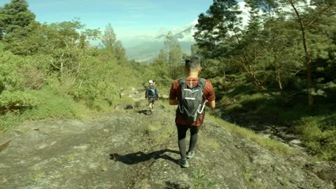 Three Peoples Running Down The Rocky Hill Among The Valley Stock Footage 152790315