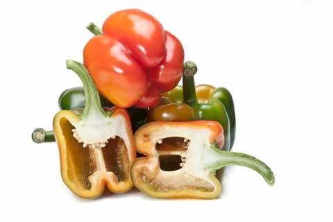 Three peppers and two halves. Stock Photos