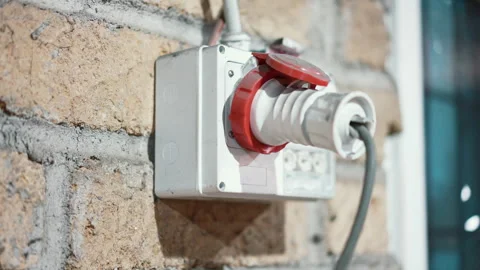 Three-phase electrical power supply socket on external wall, plug in high Stock Footage 262560451