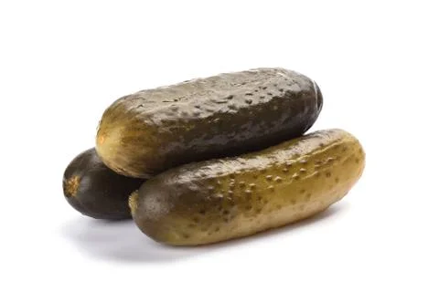 Three pickled cucumbers isolated on white background. Salting concept. Stock Photos