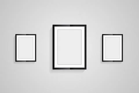 Three picture frames with black blank hanging on the whitewall for mock up .. Stock Illustration
