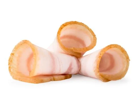 Three pieces of bacon rolls close up on a white. Isolated. Stock Photos