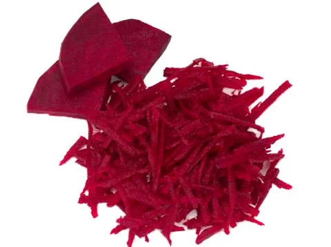 Three pieces of beetroot and grated beets on white background Stock Photos