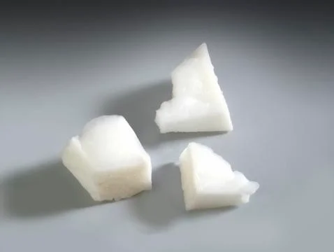 Three pieces of coconut Stock Photos