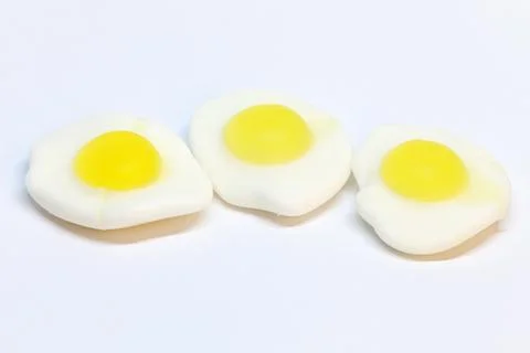 Three pieces of fried candy eggs on a white background Stock Photos