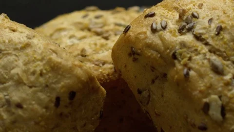 Three pieces of integral bread on a wooden board Video stock 117343536