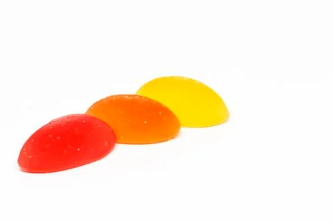 Three pieces of raspberry boats sweets on white background Foto stock