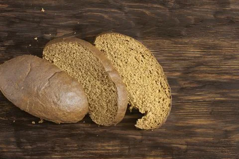 Three pieces of rye bread on the table Stock Photos