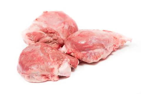Three pig cheeks raw pieces in a white background Stock Photos