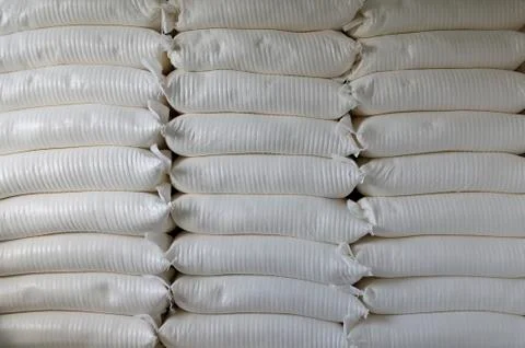 Three piles of big sacks at warehouse in modern factory Stock Photos