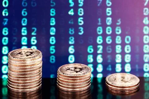 Three piles of bitcoins with numbers in backgrounds Stock Photos