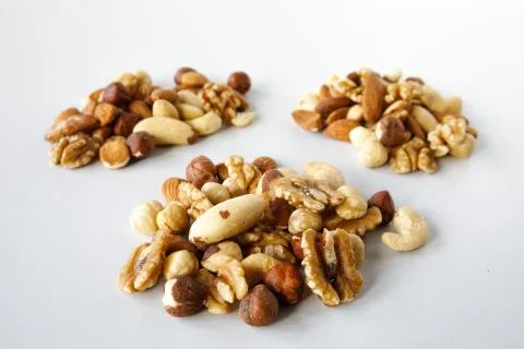 Three piles of various nuts Foto stock