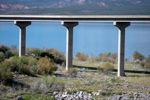 Three pillars supporting a thin steel reenforced concrete bridge Stock Photos